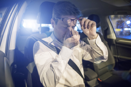 man experiencing eye fatigue when driving